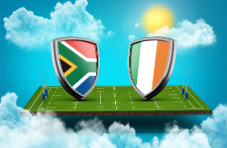 A 3D image of two shields, one with the South African flag, the other with the Irish flag, on a rugby field against a sunny blue