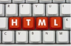 computer keyboard with HTML on red keys
