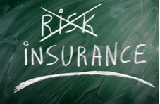 writing on a blackboard:  Risk, crossed out, and Insurance
