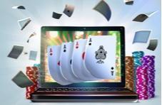 a laptop screen showing 4 Aces and poker chips flying around