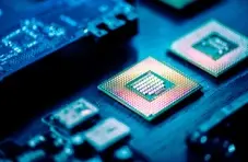 A closeup image with a blue hue of a GPU chip on a motherboard