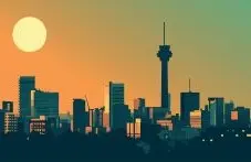 A flat-style illustration of the Johannesburg skyline with the Hillbrow Tower at sunset on an orange and green background