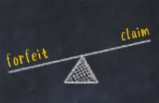 An illustration of a chalkboard balance scale comparing the words “forfeit” and “claim” on a dark textured background