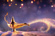 An image of a magical genie lamp on sand, with a sparkly background