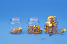 Three mason jars filled to various levels with coins on a blue background