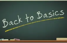 An image of a green chalkboard with the words ‘back to basics’ in white chalk, underlined in yellow