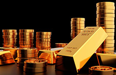 An image of stacks of gold coins and gold ingots on a black background 