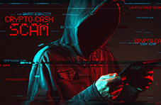 A photo of a faceless man in a hoodie on a smart device with 'crypto cash scam' and other digitized words on a dark background