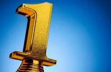 A big gold trophy number 1 on a golden background