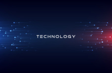 An image of the word ‘technology’ on an abstract dark background with red and blue lighting 