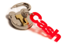 A padlock with a red ‘cash’ keychain on a white background