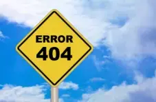 An illustration of a yellow road sign displaying “Error 404” against a bright blue sky with clouds