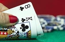 a blackjack hand showing the King and 8 of clubs