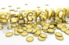 Blackjack in gold letters with gold coins all around