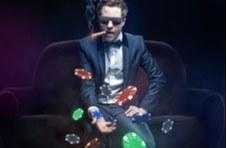 guy in a suit smoking a cigar throwing casino chips up in the air