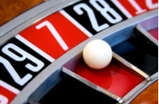 close-up image of a roulette table with the ball in the 7 slot