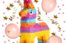 A brightly coloured donkey piñata with pink balloons and party décor on a white background