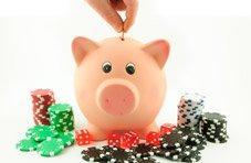 a player putting coins into a piggy bank