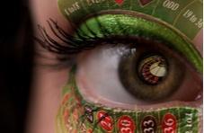 close-up of an eye with make-up to resemble a roulette table