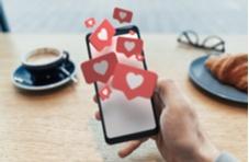 heart messages coming out of a mobile phone