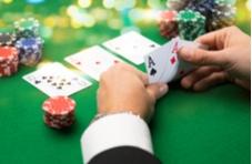 a poker table with chips and dollar bills in a pile