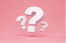 illustration of three white 3D question marks on a pale pink background