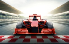 A 3D realistic image of a red Formula One racing car, crossing the checkered finish line against a blurred background