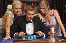 James Bond standing next to a roulette table.