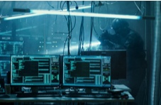A special forces soldier uncovering a hackers lair full of monitors displaying software code with a blue hue on the image