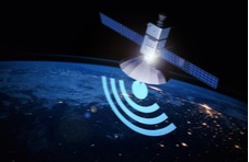 communications satellite flying above the earth sending signals to earth