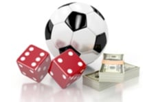 a soccer ball with cash and dice