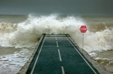 Surging waves covering a highway