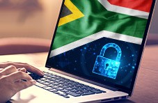 a padlock and a South African flag on a computer print out