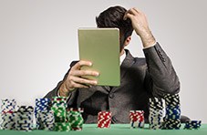 Video poker player using a strategy card