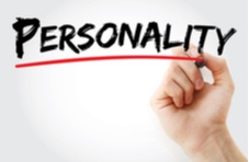 The word PERSONALITY written in a black marker with a human hand underlining it with a marker in red