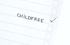 A checklist on a piece of paper with a tick next to the hand written word childfree’